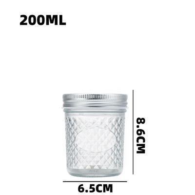 Embossed Clear Glass Storage Jar With Screw Cap For Coffee Bean Peanut Oatmeal